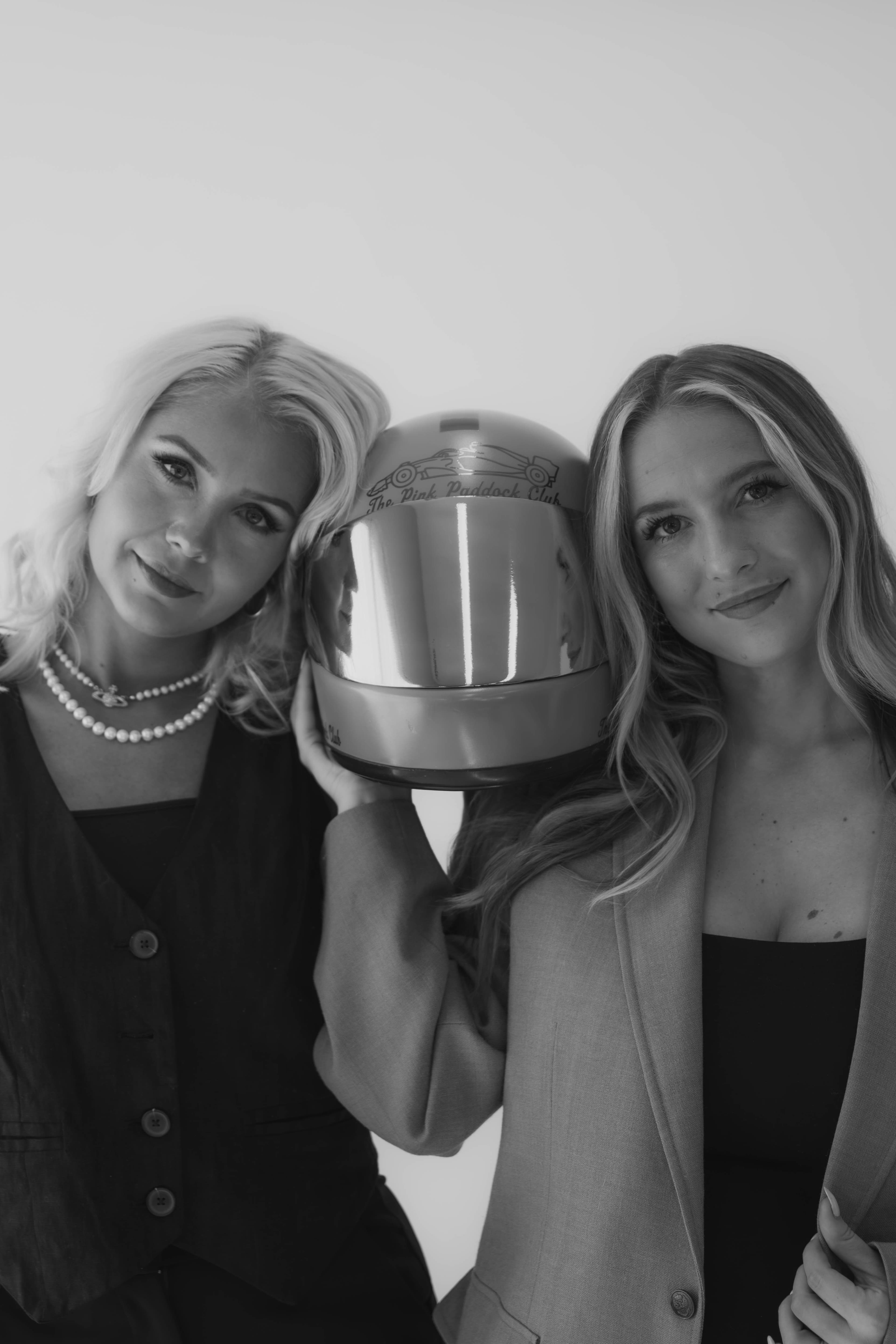 Jensen and Adri with their Pink Paddock Club helmet